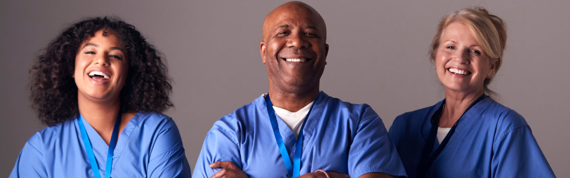 Three caregivers smiling